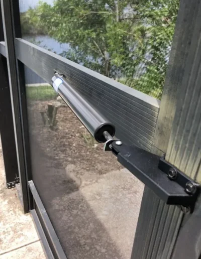 A close up of a window with a motor attached to it.
